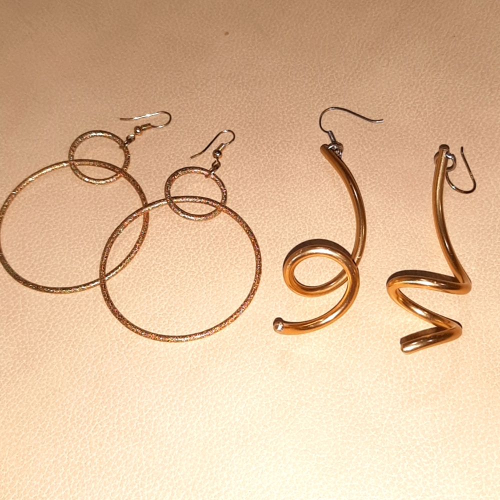 Two pairs of large vintage gold costume earrings